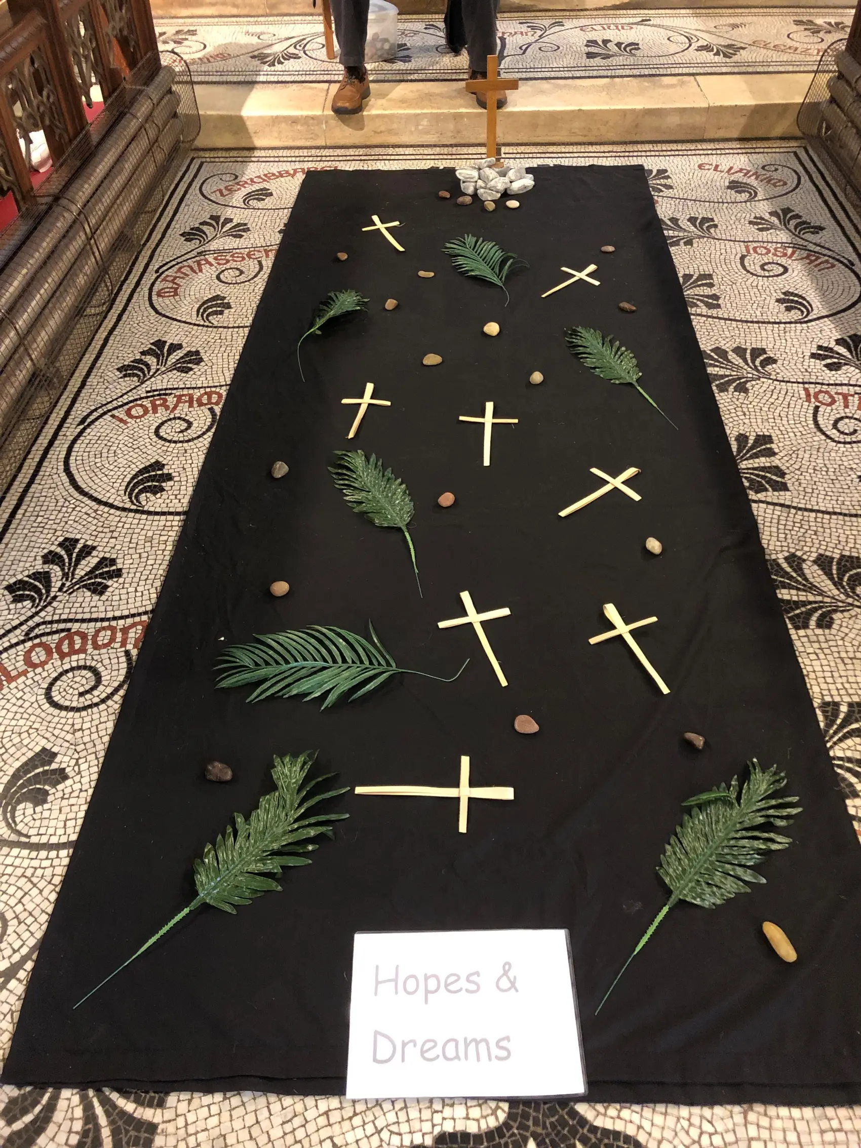 palms and crosses laid out on the floor to represent Palm Sunday